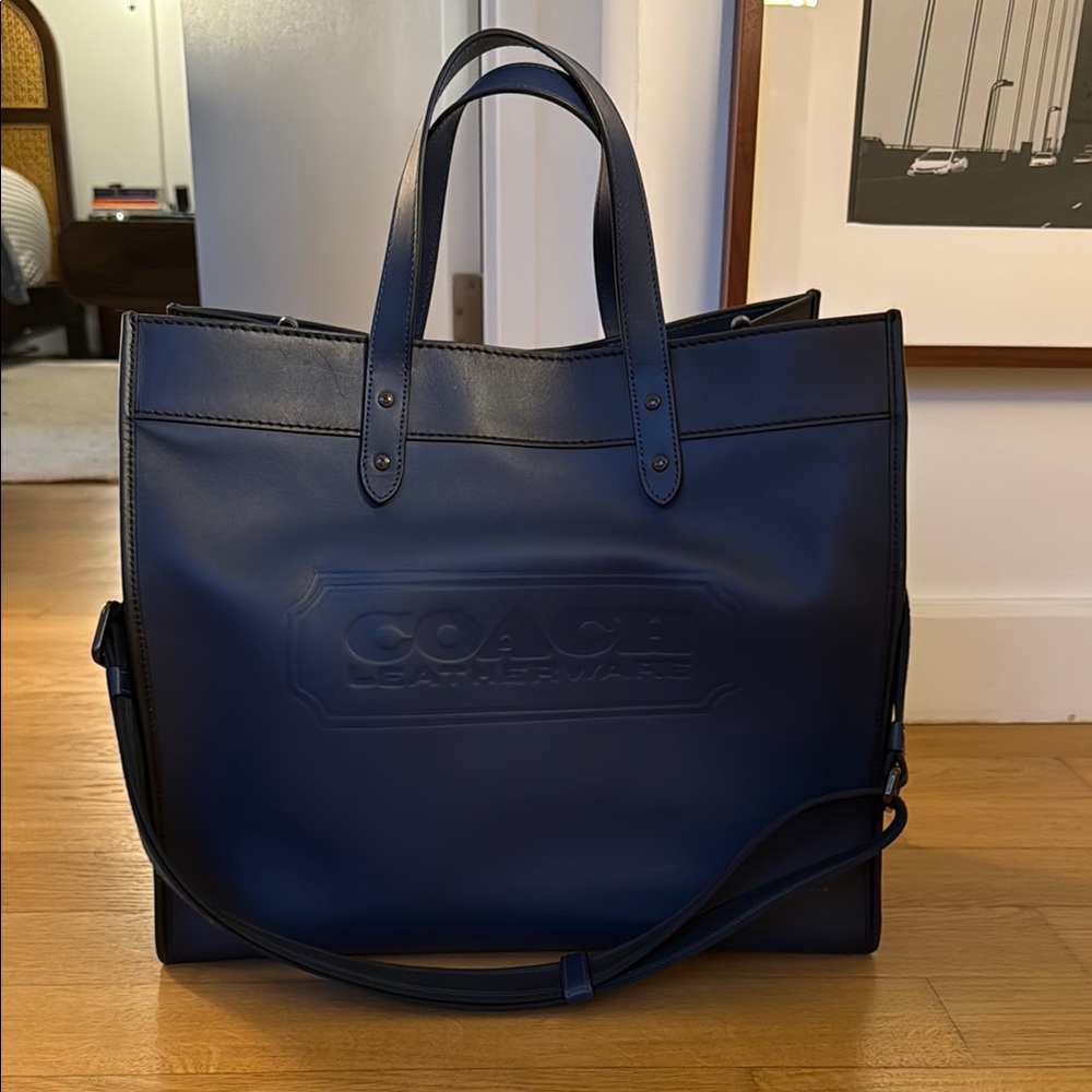 Coach Blue Leather Field Tote with top handle and shoulder strap.